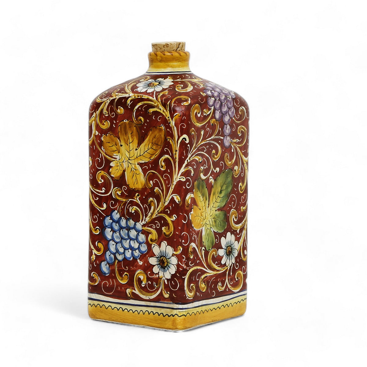 TUSCAN MAJOLICA: Old World Tuscan square bottle with cork with Leaves and grape designs on a Burgundy red background